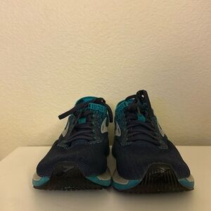 Navy Blue and Teal Brooks Ricochet running shoe.